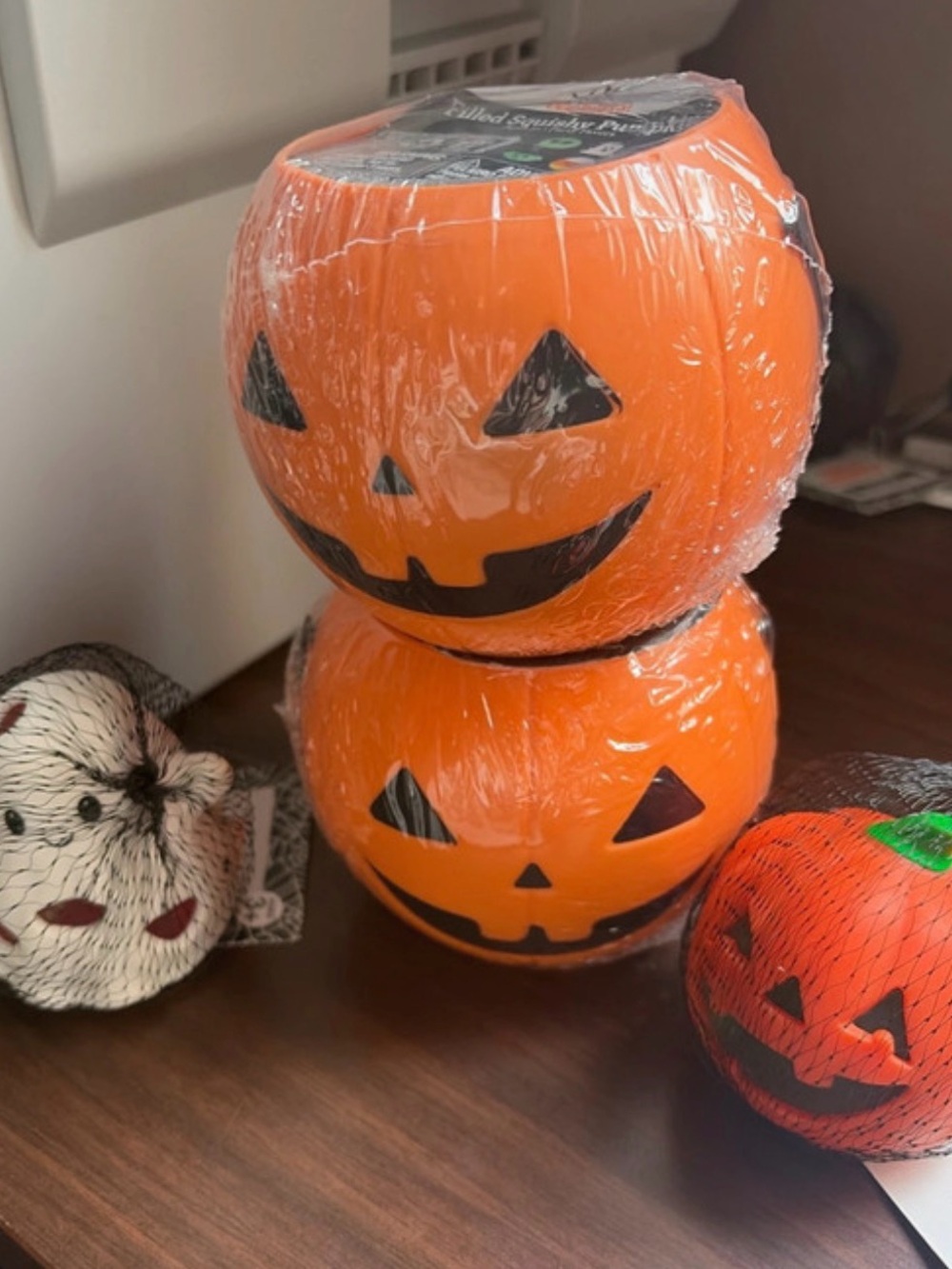 2 squishy filled buckets and 2 Halloween squishy toys